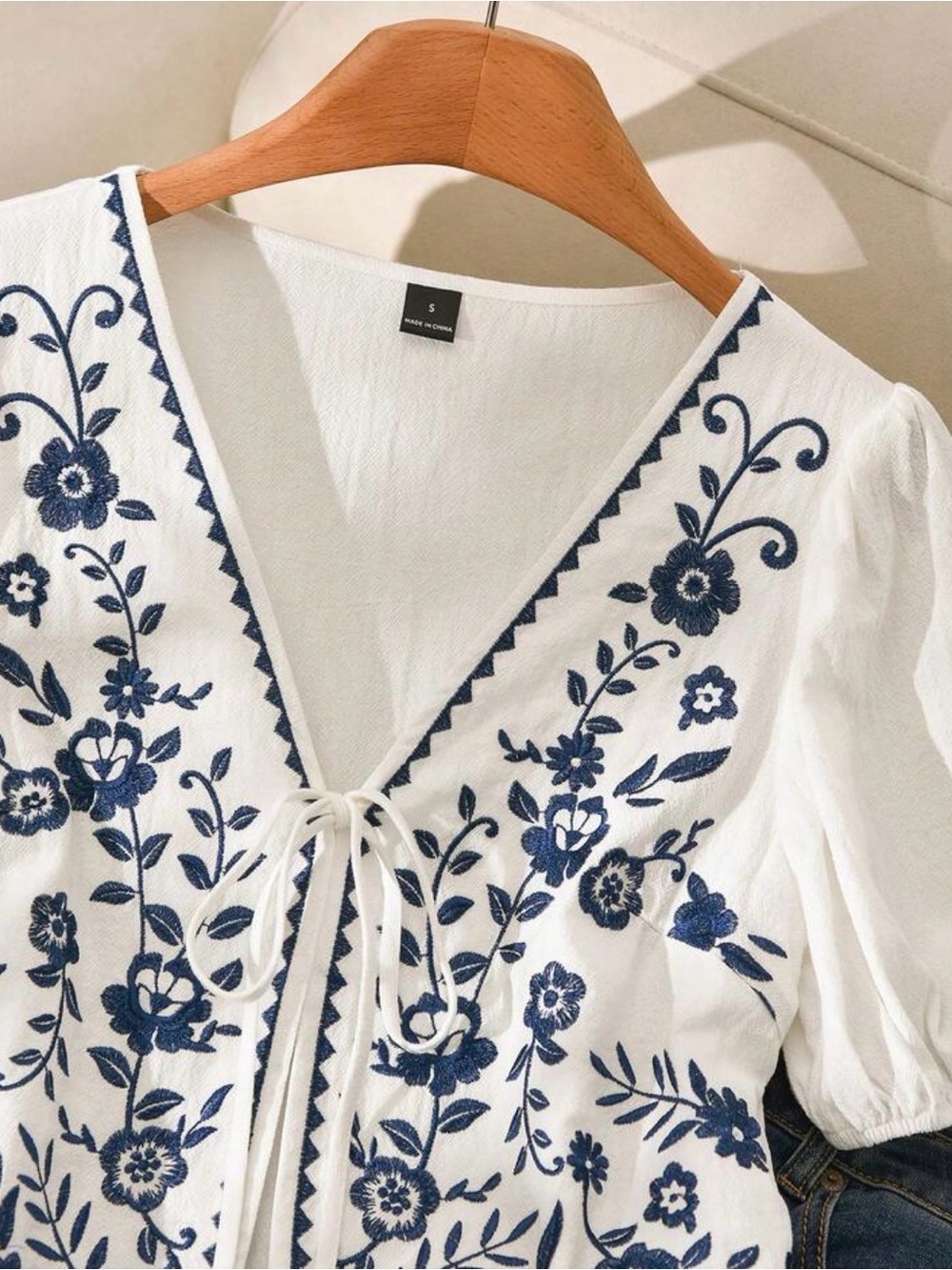 Embroidered White Peasant Tie-Front Top with Navy Floral Details - Picture 2 of 3